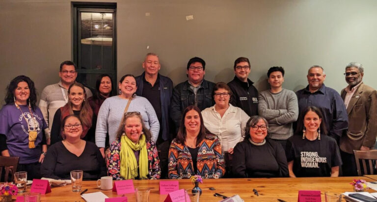 group picture of more than a dozen members of the Indigenous Health Coalition at Common Ground Health